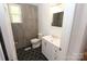 Modern bathroom with white vanity, and hexagon tile floor at 306 E Burnsville St, Wadesboro, NC 28170