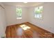 Bright bedroom with natural light, and gleaming hardwood floors at 306 E Burnsville St, Wadesboro, NC 28170