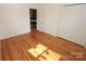 Bright bedroom with closet, and gleaming hardwood floors at 306 E Burnsville St, Wadesboro, NC 28170