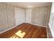 Cozy bedroom with closet, and gleaming hardwood floors at 306 E Burnsville St, Wadesboro, NC 28170