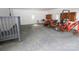 Spacious carport interior with storage, a concrete floor, ample natural light, and equipment at 306 E Burnsville St, Wadesboro, NC 28170