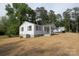 Charming single-story home with light siding, dark shutters, and a welcoming front porch in a well-kept yard at 306 E Burnsville St, Wadesboro, NC 28170