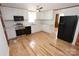 Updated kitchen with stainless steel appliances, white cabinets, and wood floors at 306 E Burnsville St, Wadesboro, NC 28170