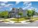 Well-maintained home with a front porch, two-car garage, and a neatly landscaped lawn at 4406 Huntley Glen Dr, Pineville, NC 28134