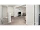 Open living room area with carpet, tv, and access to other rooms at 4406 Huntley Glen Dr, Pineville, NC 28134