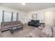 Comfortable living room with plush sofas, natural light, and neutral decor at 4406 Huntley Glen Dr, Pineville, NC 28134