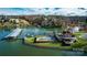 Aerial view of a waterfront property, including a large pool, covered boat dock, and stunning lake views at 4465 3Rd Nw St, Hickory, NC 28601