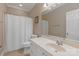 Well-lit bathroom featuring vanity with white cabinetry, neutral paint and a shower-tub combination at 4465 3Rd Nw St, Hickory, NC 28601