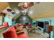 Finished bonus room with unique ceiling fan, media center, and comfortable seating area at 4465 3Rd Nw St, Hickory, NC 28601