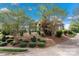 Luxury home with lush front yard, mature landscaping, and brick facade at 4465 3Rd Nw St, Hickory, NC 28601