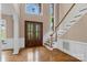 Grand two-story foyer with hardwood floors, staircase, and a light-filled entry at 4465 3Rd Nw St, Hickory, NC 28601