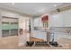 Spacious kitchen features stainless steel appliances, white cabinets, and a view into living room at 4465 3Rd Nw St, Hickory, NC 28601