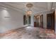 Grand living room featuring terracotta tile flooring, decorative ceiling, and ornate doorway at 4465 3Rd Nw St, Hickory, NC 28601
