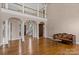 Elegant living space with hardwood floors, pillars, and a view of the staircase at 4465 3Rd Nw St, Hickory, NC 28601