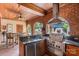 Outdoor kitchen area featuring a grill, stainless steel appliances, granite countertops and brick accents at 4465 3Rd Nw St, Hickory, NC 28601