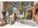 Picturesque outdoor patio with pergola, stone columns, fireplace, comfortable seating and lush landscaping at 4465 3Rd Nw St, Hickory, NC 28601