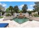 Beautiful swimming pool with stone accents, water features, tiled deck and lush landscaping at 4465 3Rd Nw St, Hickory, NC 28601