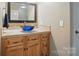 Charming vanity area with a stunning blue glass sink and plenty of storage at 4561 Walden Pond Trwy, Concord, NC 28025