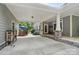 Covered carport featuring stone column accents and easy access to the home's entrance and outdoor area at 4561 Walden Pond Trwy, Concord, NC 28025