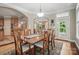 Dining room with wood table and view into the kitchen and sunroom at 4561 Walden Pond Trwy, Concord, NC 28025