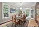 Dining room with natural light from the large windows and stylish chandelier at 4561 Walden Pond Trwy, Concord, NC 28025