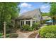 Charming home exterior with well-maintained landscaping, sunroom, and a stone walkway at 4561 Walden Pond Trwy, Concord, NC 28025