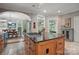 Kitchen island cooktop with a view into the dining room at 4561 Walden Pond Trwy, Concord, NC 28025