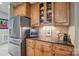 Close up of the kitchen featuring stainless steel appliances, tile backsplash, and wood cabinets at 4561 Walden Pond Trwy, Concord, NC 28025