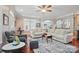 Spacious living room with hardwood floors, large sectional, and abundant natural light at 4561 Walden Pond Trwy, Concord, NC 28025