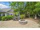 Outdoor patio with a stone fire pit and comfortable seating, perfect for entertaining or relaxation at 4561 Walden Pond Trwy, Concord, NC 28025