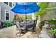 Outdoor dining space with patio seating under a large umbrella, great for outdoor entertaining at 4561 Walden Pond Trwy, Concord, NC 28025