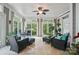 Inviting sunroom with tile floor and ample light from the large windows at 4561 Walden Pond Trwy, Concord, NC 28025
