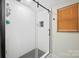 Sleek bathroom featuring a glass-enclosed shower with a black accent frame at 600 3Rd St, Spencer, NC 28159