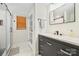 Elegant bathroom with modern vanity, marble floors, and a glass-enclosed shower at 600 3Rd St, Spencer, NC 28159