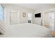 Well-lit bedroom with modern decor, a TV, and access to an en-suite bathroom at 600 3Rd St, Spencer, NC 28159