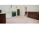 Spacious bedroom with fireplace, neutral carpet, and classic wooden furniture at 600 3Rd St, Spencer, NC 28159