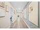 Bright hallway with updated flooring, leading to laundry room with sliding barn door at 600 3Rd St, Spencer, NC 28159