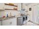 Modern kitchen featuring stainless steel appliances, granite countertops, and white subway tile backsplash at 600 3Rd St, Spencer, NC 28159