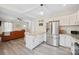 Modern kitchen boasts stainless steel appliances, granite countertops, and an eat-in island with seating at 600 3Rd St, Spencer, NC 28159