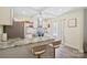 Bright and airy kitchen features stainless appliances, granite counters, and a convenient center island at 600 3Rd St, Spencer, NC 28159