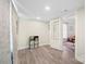 View of room with an open doorway, leading to a sitting room at 600 3Rd St, Spencer, NC 28159