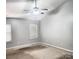 Spacious bedroom featuring neutral walls, carpet, and ceiling fan with overhead lighting at 616 Mountain Quail Dr, Charlotte, NC 28216