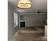 Spacious living room with a cozy fireplace, neutral carpet, and ample natural light at 616 Mountain Quail Dr, Charlotte, NC 28216