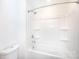 Bathroom with shower over tub combination featuring bright white tile at 6223 Rockwell W Blvd, Charlotte, NC 28269