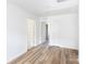 Spacious bedroom boasts hardwood floors and multiple entryways, offering both style and functionality for modern living at 6223 Rockwell W Blvd, Charlotte, NC 28269