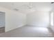 Spacious bedroom with carpet and a ceiling fan, offering a calm and inviting retreat with ample natural light at 6223 Rockwell W Blvd, Charlotte, NC 28269