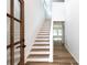 Bright foyer showcasing a staircase, luxury vinyl plank flooring and natural light at 6223 Rockwell W Blvd, Charlotte, NC 28269