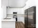 Stylish kitchen with stainless steel appliances, quartz countertops, and a modern design at 6223 Rockwell W Blvd, Charlotte, NC 28269
