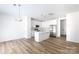 Open living area with luxury vinyl plank flooring, recessed lighting, and a modern kitchen at 6223 Rockwell W Blvd, Charlotte, NC 28269