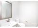 This powder room features a modern sink and a neutral color palette for a clean, contemporary look at 6223 Rockwell W Blvd, Charlotte, NC 28269